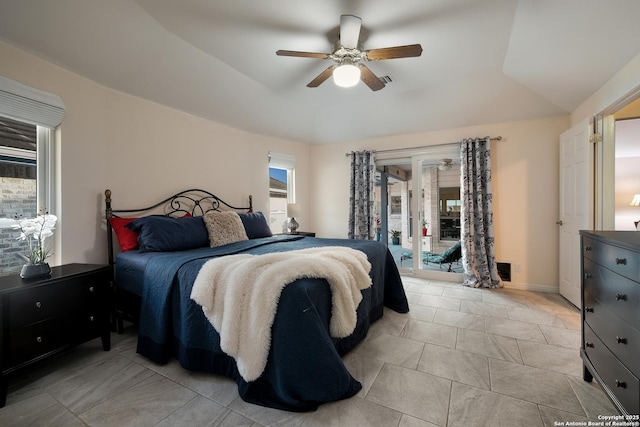 bedroom featuring access to outside, ceiling fan, and a raised ceiling