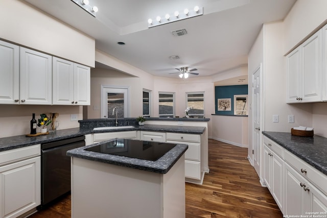 kitchen featuring sink, a center island, black appliances, kitchen peninsula, and white cabinets