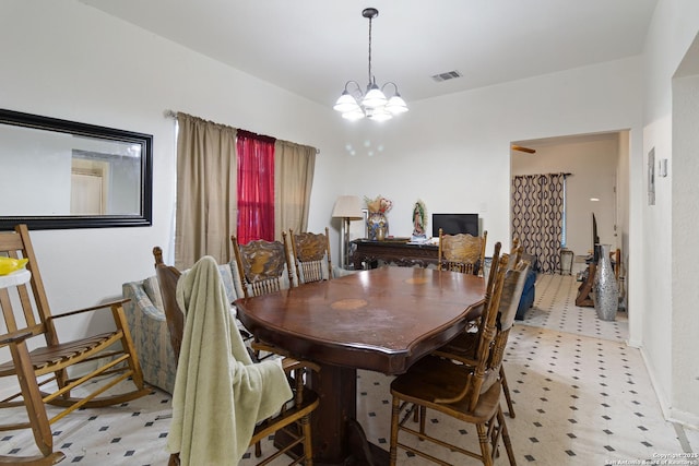 dining area featuring a chandelier