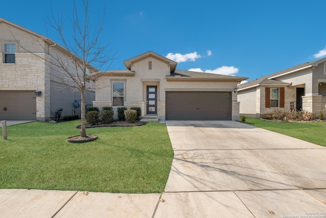 view of front of home with a garage and a front lawn