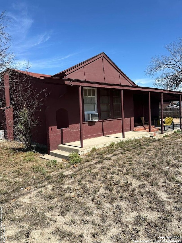 view of property exterior with a patio