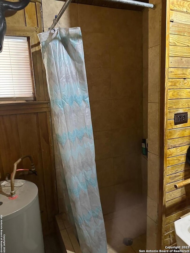 bathroom with walk in shower and water heater