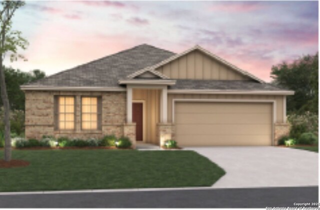 6707 Tasajillo Spgs, San Antonio, TX 78253 - ranch-style house with concrete driveway, an attached garage, a yard, and board and batten siding