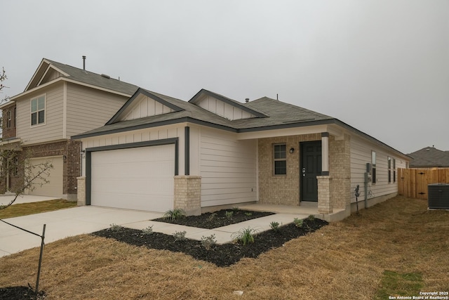 6707 Tasajillo Spgs, San Antonio, TX 78253 - view of front of property with cooling unit, driveway, fence, brick siding, and board and batten siding
