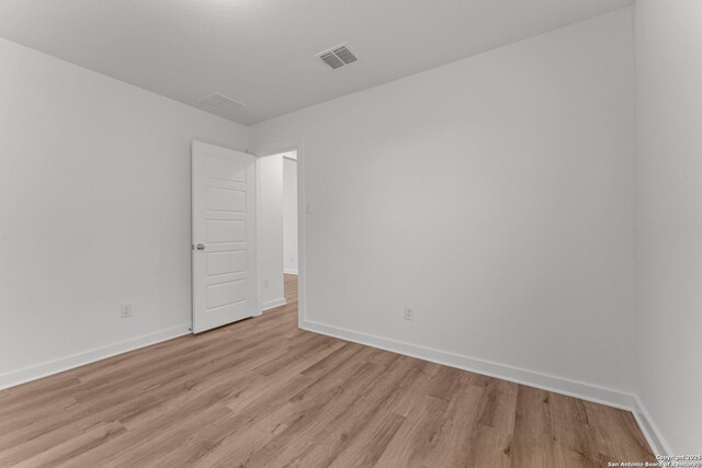 6707 Tasajillo Spgs, San Antonio, TX 78253 - unfurnished room with light wood-style floors, visible vents, and baseboards