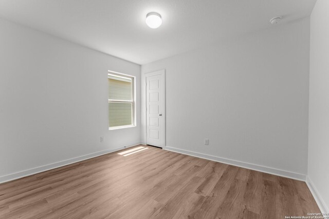 6707 Tasajillo Spgs, San Antonio, TX 78253 - spare room featuring baseboards and light wood-style floors