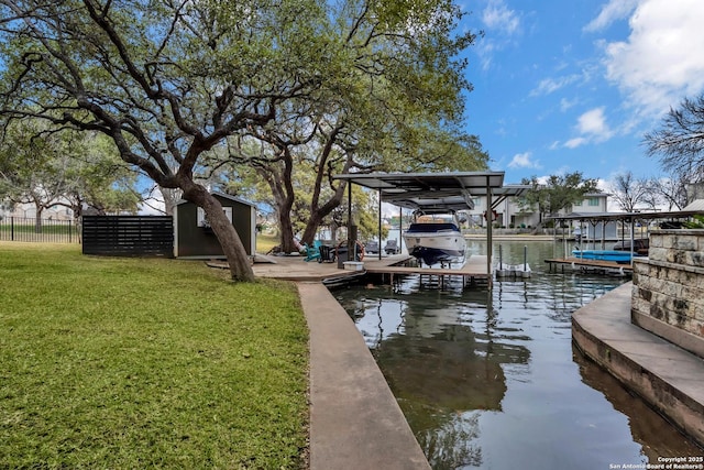 dock area featuring a yard and a water view