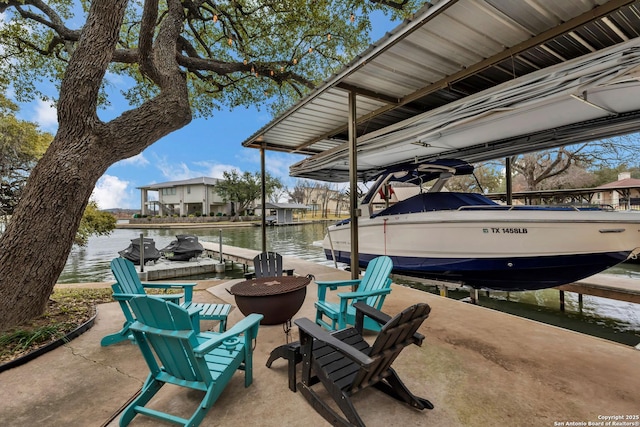 view of patio / terrace featuring a dock and a water view