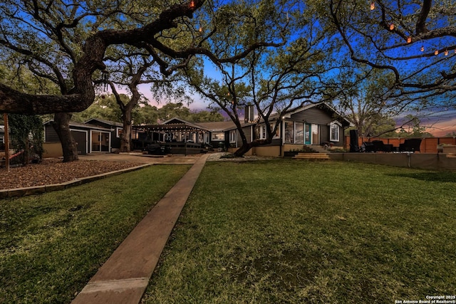 view of yard at dusk