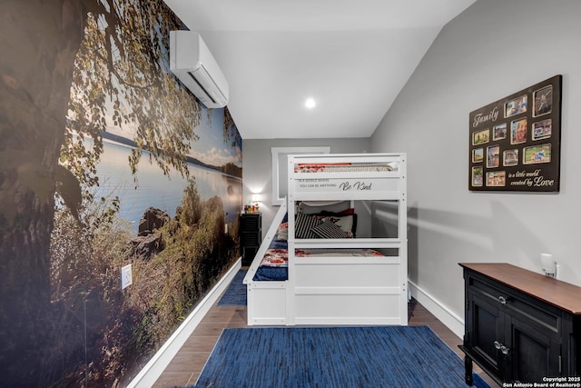 bedroom with dark wood-type flooring, lofted ceiling, and a wall mounted air conditioner