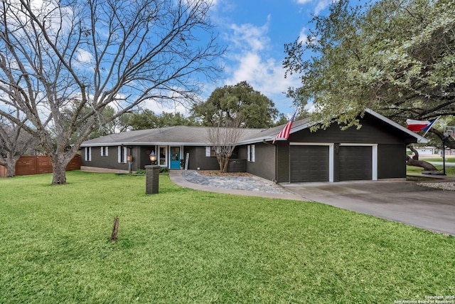 ranch-style house with a garage, central air condition unit, and a front lawn