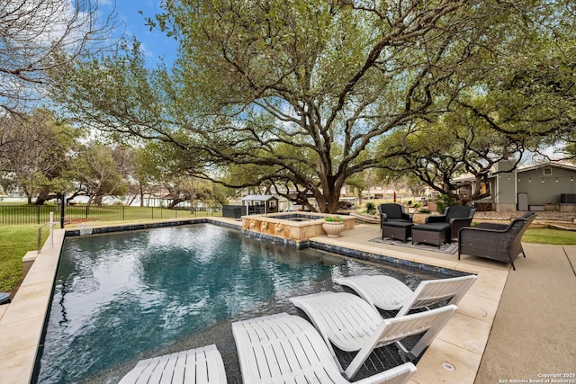 view of swimming pool featuring a patio and an in ground hot tub