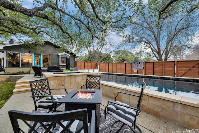 view of patio / terrace with an outdoor structure, an outdoor fire pit, and a bar