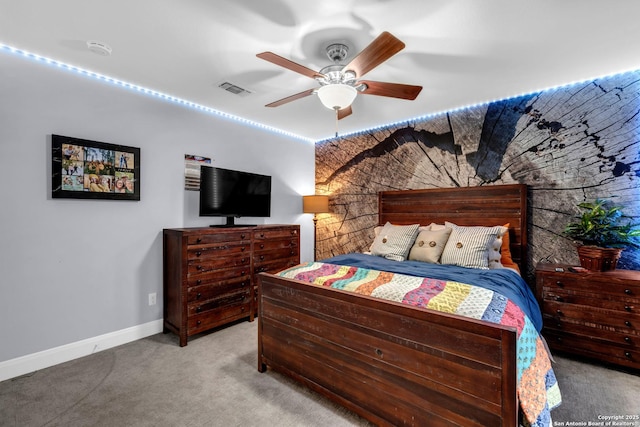 bedroom featuring light carpet and ceiling fan