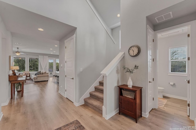 stairs with wood-type flooring