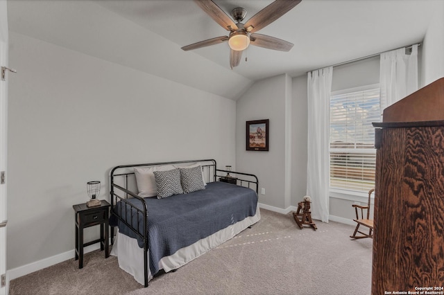 carpeted bedroom with lofted ceiling and ceiling fan