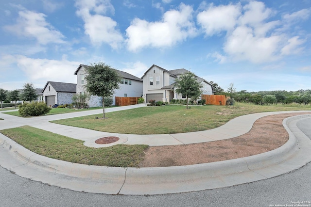 view of front of house with a front yard and a garage