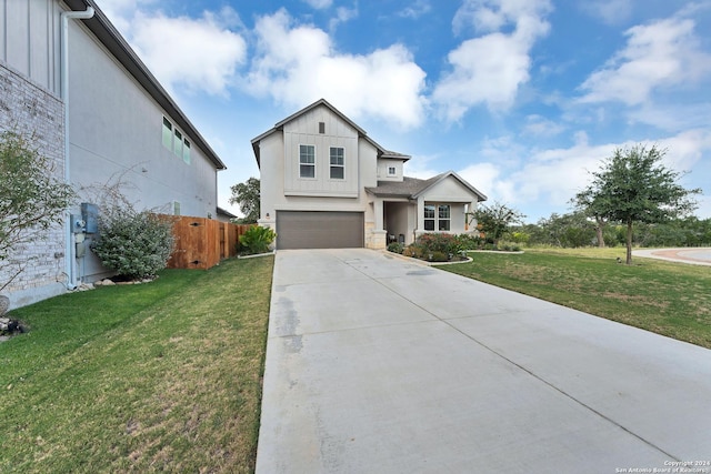 view of front of property with a front lawn and a garage