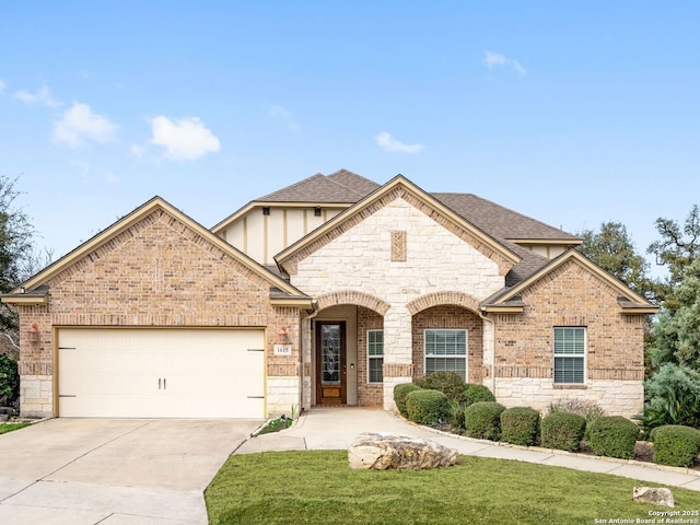 view of front of home with a garage and a front yard