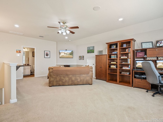 living room featuring ceiling fan and light colored carpet