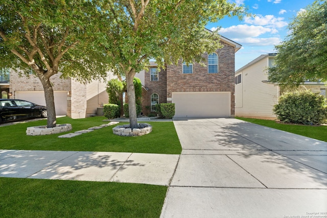 view of front facade with a front lawn and a garage