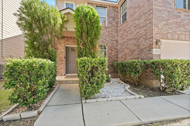 entrance to property featuring a garage