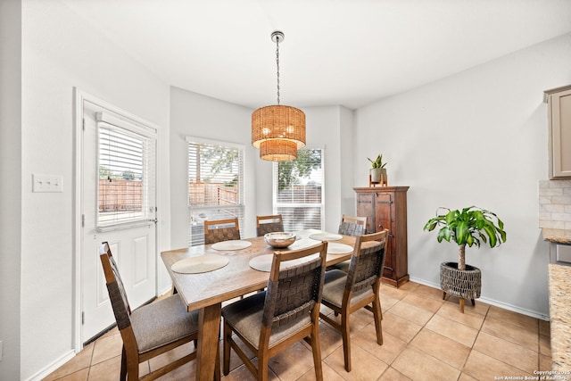 dining area featuring light tile patterned floors