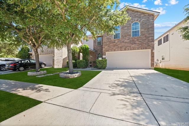 view of front facade featuring a front yard and a garage