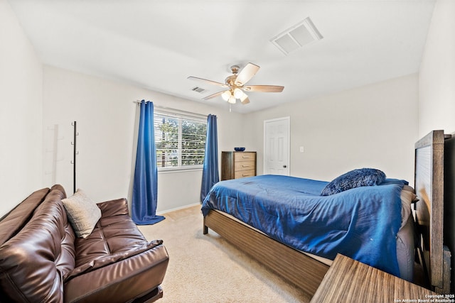 bedroom with ceiling fan and light colored carpet