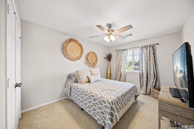 bedroom with light carpet and ceiling fan