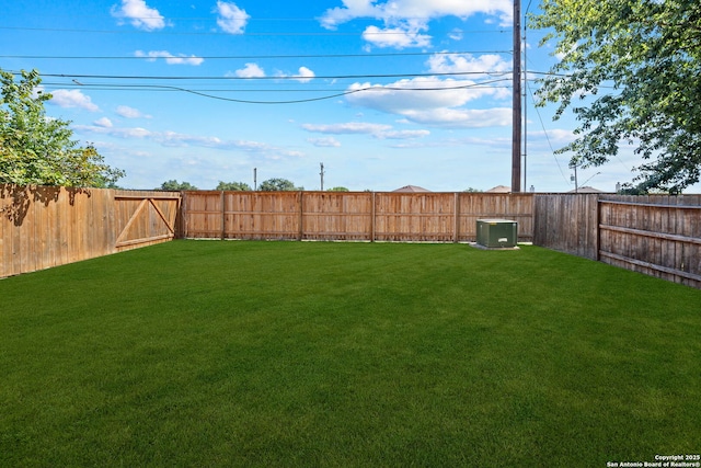 view of yard featuring central AC