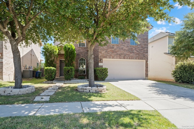 view of front facade with a front yard and a garage