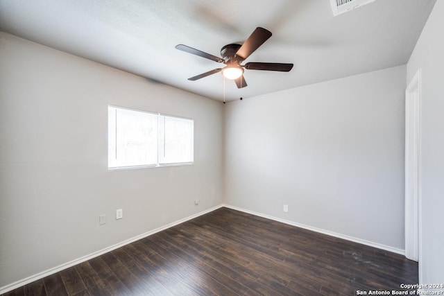 unfurnished room featuring dark hardwood / wood-style floors and ceiling fan