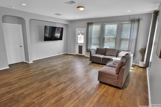 living room featuring dark hardwood / wood-style flooring