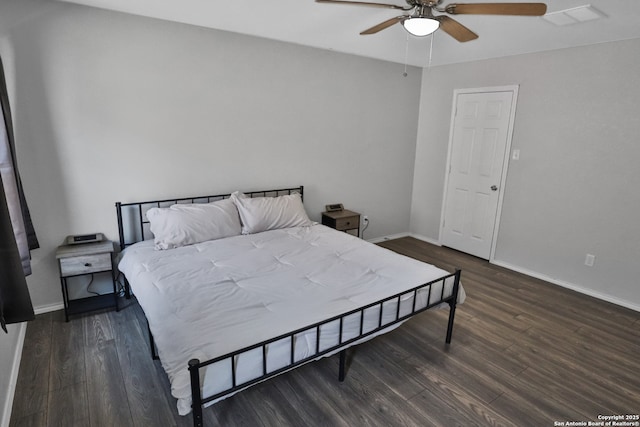 bedroom featuring ceiling fan and dark wood-type flooring