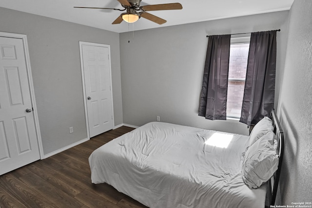 bedroom featuring dark hardwood / wood-style flooring and ceiling fan