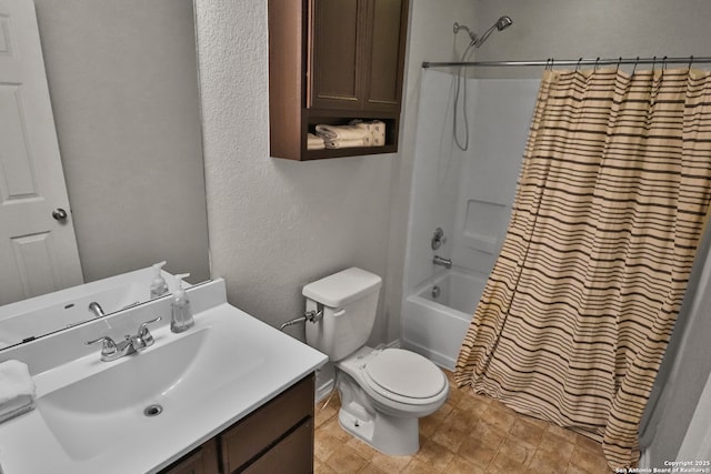 full bathroom featuring vanity, shower / tub combo with curtain, and toilet