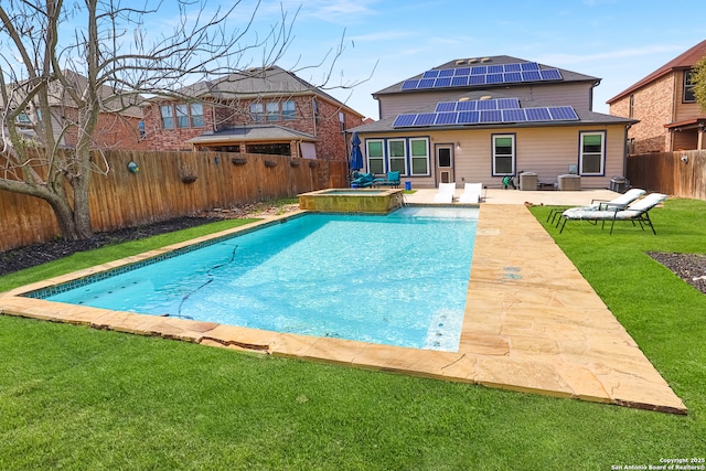 view of swimming pool featuring a patio, an in ground hot tub, and a lawn