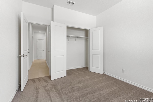 405 Panther Way, Seguin, TX 78155 - unfurnished bedroom with carpet flooring, a closet, and baseboards