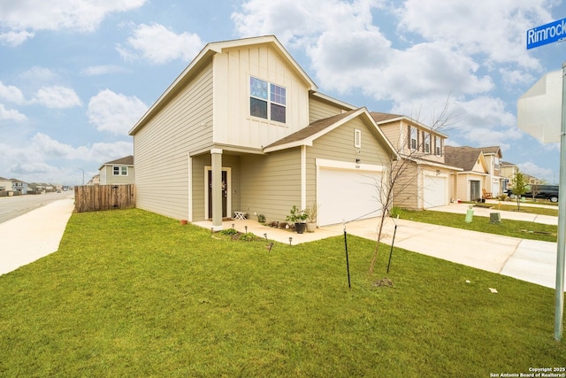 view of front of house featuring a front lawn and a garage