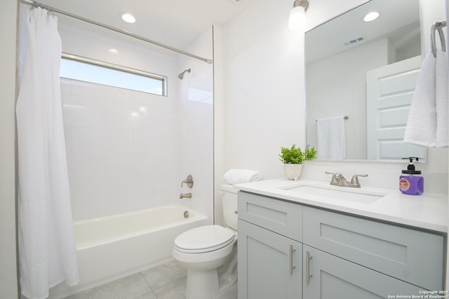 full bathroom featuring tile patterned flooring, vanity, toilet, and shower / tub combo