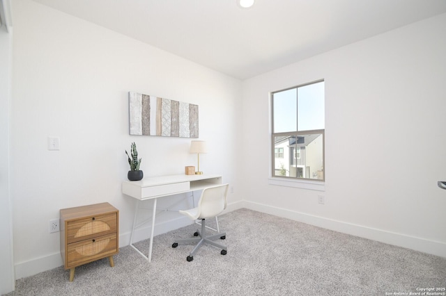 unfurnished office featuring light colored carpet