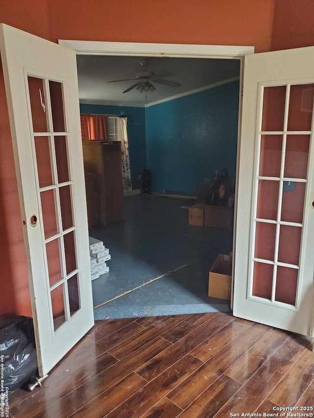 interior space featuring a ceiling fan and wood finished floors