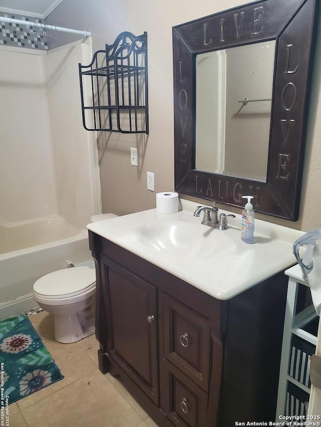 bathroom featuring tub / shower combination, vanity, toilet, and tile patterned floors