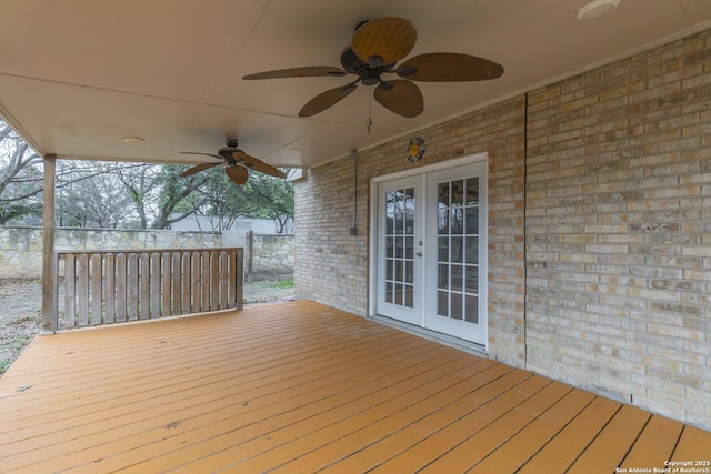 deck featuring french doors and ceiling fan