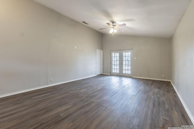 empty room with ceiling fan, dark wood-type flooring, vaulted ceiling, and french doors