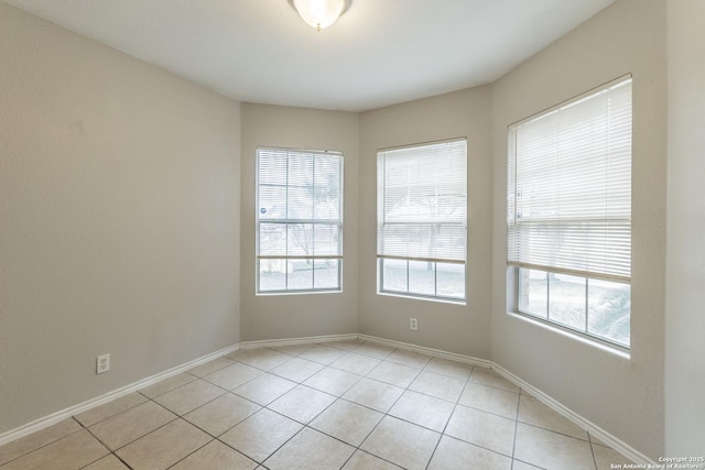 tiled empty room with plenty of natural light