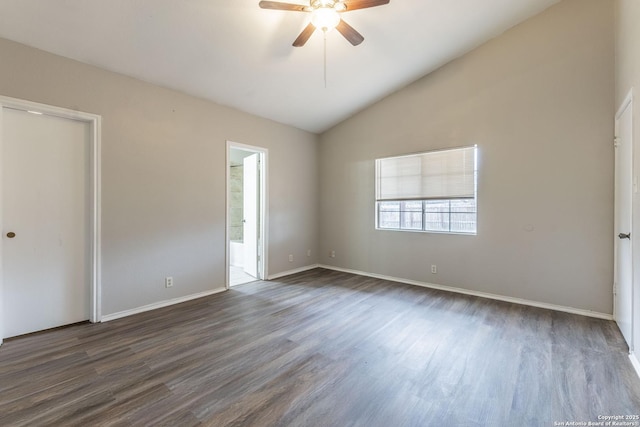 unfurnished bedroom featuring ensuite bath, ceiling fan, lofted ceiling, and dark hardwood / wood-style flooring