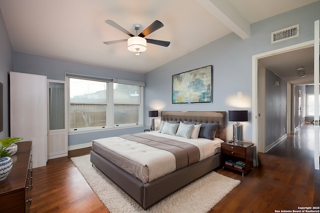 bedroom featuring dark wood-type flooring, vaulted ceiling with beams, and ceiling fan