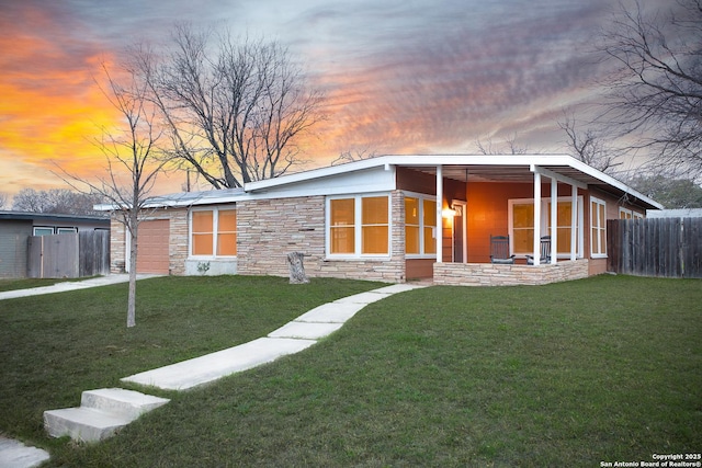 view of front of house with a yard